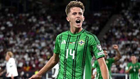 Isaac Price celebrating scoring for Northern Ireland against Germany