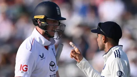 England opener Zak Crawley (left) and India captain Shubman Gill (right) exchange words