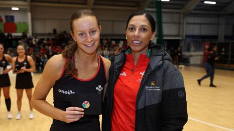 Wales' Vicky Booth (L) celebrates with an award