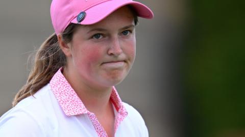 Lottie Woad reacts to missing a 10-foot birdie putt on the 18th at the Evian Championship