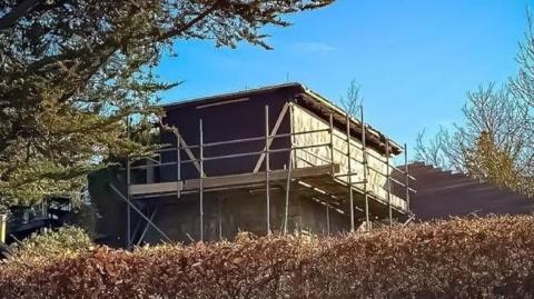 A building overlooking a garden