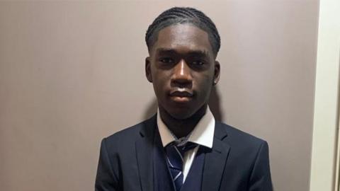 headshot portrait of Marcus Fakana in school uniform