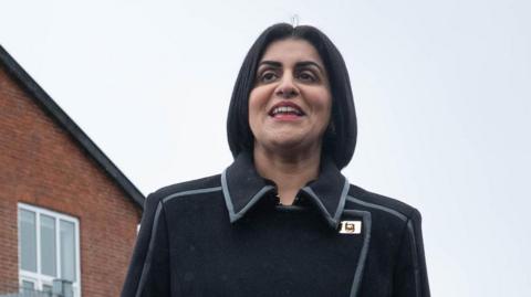 Home Secretary Shabana Mahmood - in black winter coat - visits the Sjælsmark Returns Centre, on the outskirts of Copenhagen where migrant arrivals reside ahead of removal