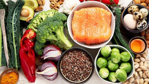 Various brain food products: fish, meat, nuts, vegetables and greens. Healthy food on a light background. Top view.