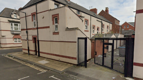 An alley gate on Dent Street in Hartlepool standing open