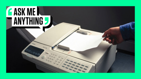 A fax machine being used in the 1990s