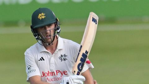 Olly Stone raises the bat for Nottinghamshire