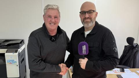 Steve Bruce with BBC Radio Norfolk's Rob Butler