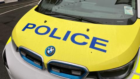 A Guernsey Police car sitting on a road