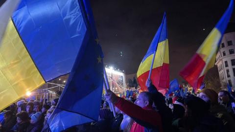 Romanians fly flags in the centre of Bucharest 