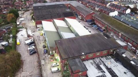 An aerial shot Botany Commercial Centre  which is made up of a series of warehouse buildings set among terraced housing