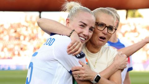 Sarina Wiegman hugs Alex Greenwood