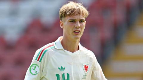 Joe Lacey in action for Wales