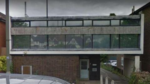 A grey building.