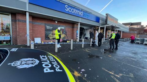 Police officers at the scene of the first attempted ATM robbery in Glasgow