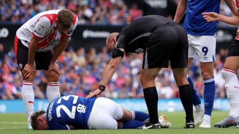 Sammie Szmodics lying on the ground during Ipswich's game against Southampton