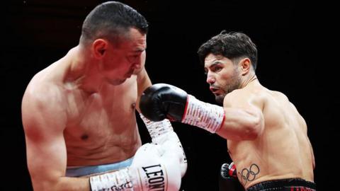 Josh Kelly lands a punch on Flavius Biea