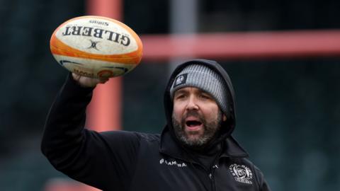 Exeter Chiefs Women coach Steve Salvin holds a rugby ball