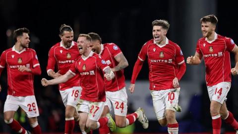 Wrexham players celebrate beating Nottingham Forest