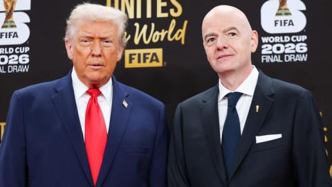 US President Doanld Trump and Fifa president Gianni Infantino stand next to each other