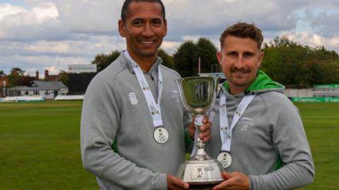 Leicestershire head coach Alfonso Thomas and assistant coach James Taylor hold the County Championship Division Two trophy