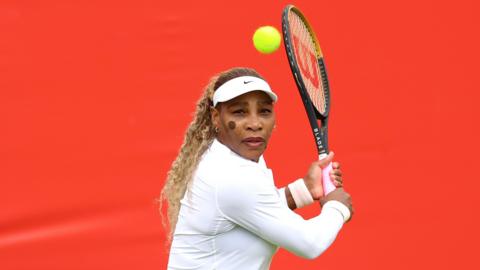 Serena Williams hits a return during practice at Queen's