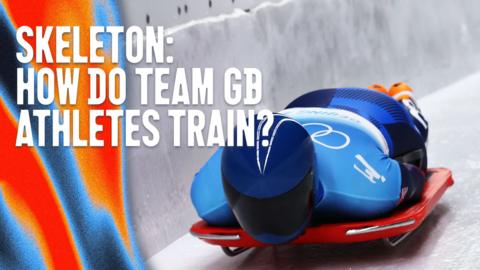 Skeleton athlete sliding down track