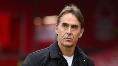 Julen Lopetegui looks on