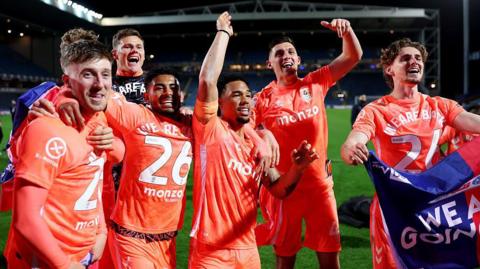 Coventry players celebrate their promotion to the Premier League