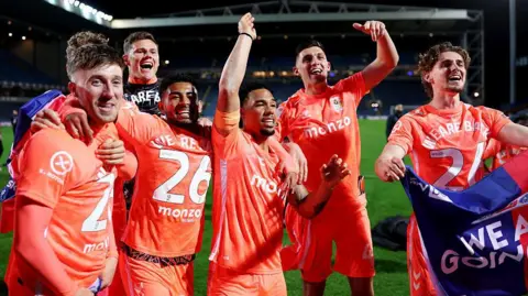 Coventry players celebrate their promotion to the Premier League