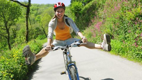 Woman cycling in the country