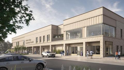 An artist's impression of what the new Shotley Bridge Hospital in Consett would look like. It's a stone-coloured brick building with large windows and a flat roof. It also has a balcony.