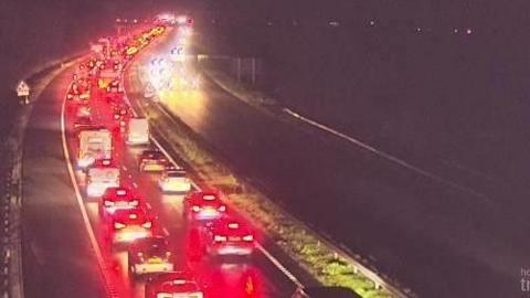 A long queue of traffic taken by a CCTV camera showing long queues of vehicles moving away from the camera