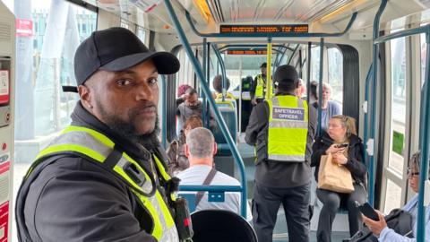 Ibrahim with other Safe Travel officers on the Clifton tram