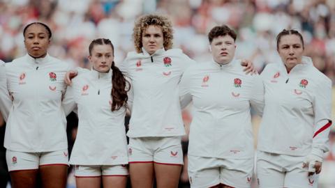 England players stand for the anthem at the 2025 World Cup final