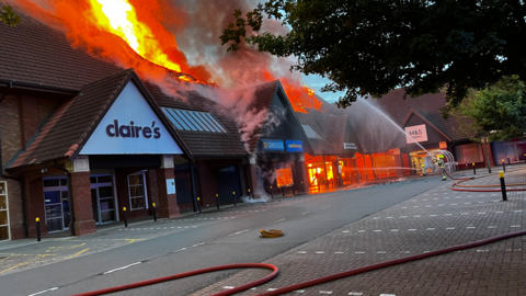 Shops on fire at a shopping centre 