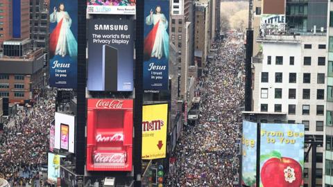A sea of protestors take the streets in New York City through Times Square.