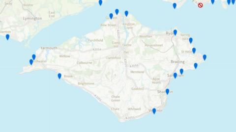 A map of the Isle of Wight, showing fifteen blue pins around the edges.