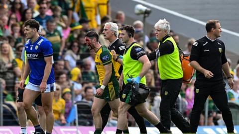 Jim McGuinness with a bloodied Ryan McHugh