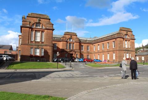 The sandstone headquarters of Dumfries and Galloway Council on a sunny day