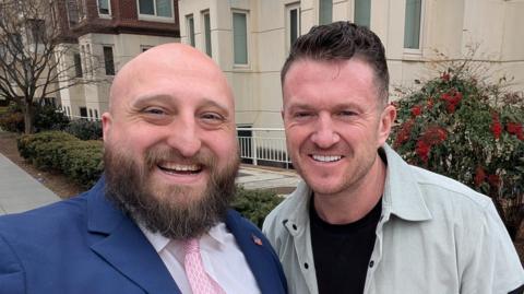 British far-right anti-Islam activist Tommy Robinson, whose real name is Stephen Yaxley-Lennon, poses for a photo with U.S. State Department official Joe Rittenhouse in Washington, D.C., U.S., February 25, 2026.