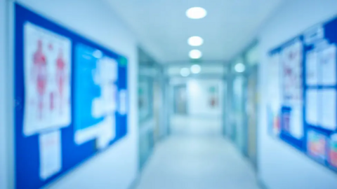 A slightly blurred stock images of a hospital ward, with posters on notice boards. 