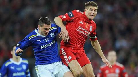 Liverpool's Steven Gerrard battles with Cardiff's Andrew Taylor during the 2012 League Cup final 