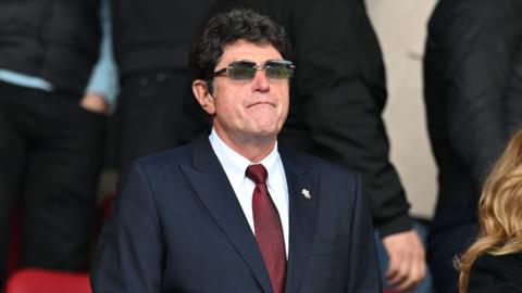 Dragan Solak looks on from the stands at St Mary's Stadium