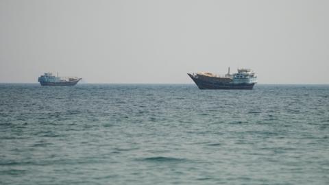 Two vessels in the Strait of Hormuz, as seen from Musandam, Oman.
