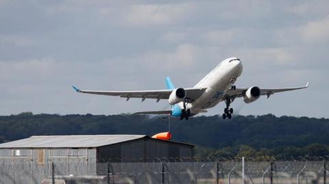 A plane taking flight from Gatwick Airport