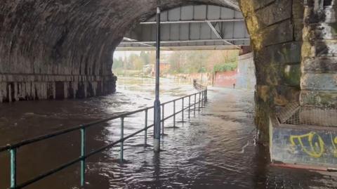 Footpaths on the River Severn in Shrewsbury covered with water amid a flooding alert 