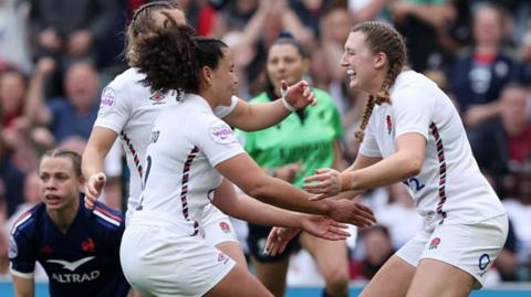 England celebrate scoring a try