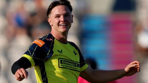 Sonny Baker celebrates taking a wicket