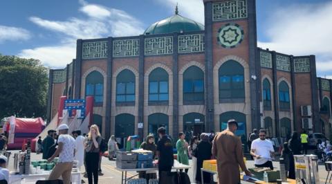 People enjoying different stall in the mosque car park